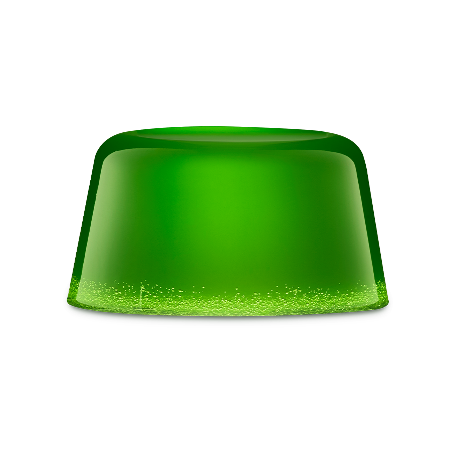 The Good Hour. A vibrant, translucent green shower jelly with a smooth, rounded dome shape. The base has tiny air bubbles, creating a sparkling gradient effect against the solid emerald green.