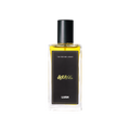 A glass perfume bottle filled with canary yellow liquid. A black label reads 'The Perfume Library' and 'Grass'.