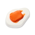 Gudetama. A glossy shower gummy shaped like an over-easy fried egg. It features a flat white base with a raised, translucent orange "yolk" in the centre that has the faint features of a lazy character face