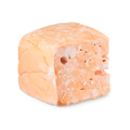 Passion Fruit Delight floating soap. A cuboid-shaped block of pastel orange soap, resembling the texture of a dense marshmallow, with a porous texture and visible holes. It has a light dusting of white powder.