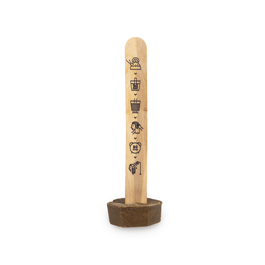 Hennaed. A solid henna hexagon on the end of a wooden stick. On the stick are instructions for use.