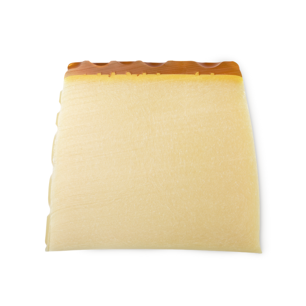 Honey I Washed the Kids. A buttery yellow, trapezium shaped soap, topped with rich golden honey, set in a honeycomb pattern.