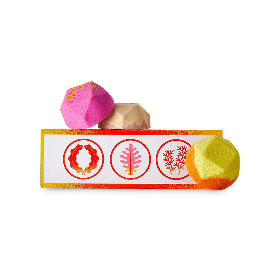 Ippuku warming gift. A warm orange and yellow patterned oblong box with three geometric bath bombs.