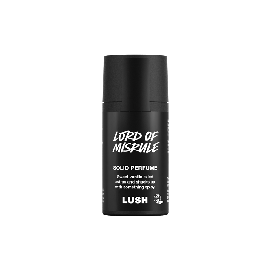Lord of Misrule. A short, cylindrical black push-up tube of the Lord of Misrule solid perfume with a black label on the front covering the cap, with the product name and scent printed on it.