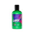 Green shower gel bottle with a black flip-top cap. The label features Luigi jumping against a purple, starry galaxy. "The Super Mario Galaxy Movie x LUSH" logos at the bottom of the label.