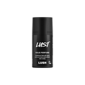 Lust. A short, cylindrical black push-up tube of the Lust solid perfume with a black label on the front covering the cap, with the product name and scent printed on it.