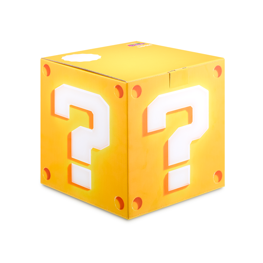 Bright yellow Question Block Gift Box cube.. Each face features a large white question mark and circular rivets in the corners. The LUSH logo is visible on the top.