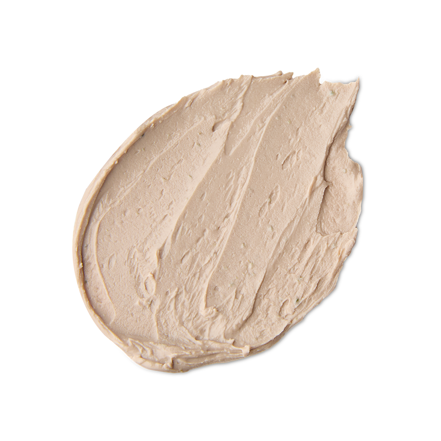 Me Time. A neatly smeared swatch of thick, creamy beige face mask with a matte finish and visible swooping peaks from being spread.