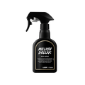 A black spray bottle of Lush 'Million Dollar' body spray. The label features white text with a gold border. The bottle has a trigger spray nozzle and contains 200ml of product.