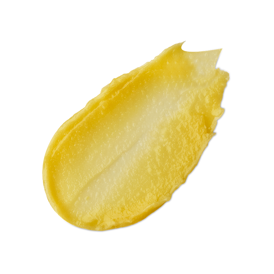 None of Your Beeswax. A neatly smeared swatch of thick, yellow honey-coloured lip balm with a slightly glossy finish.