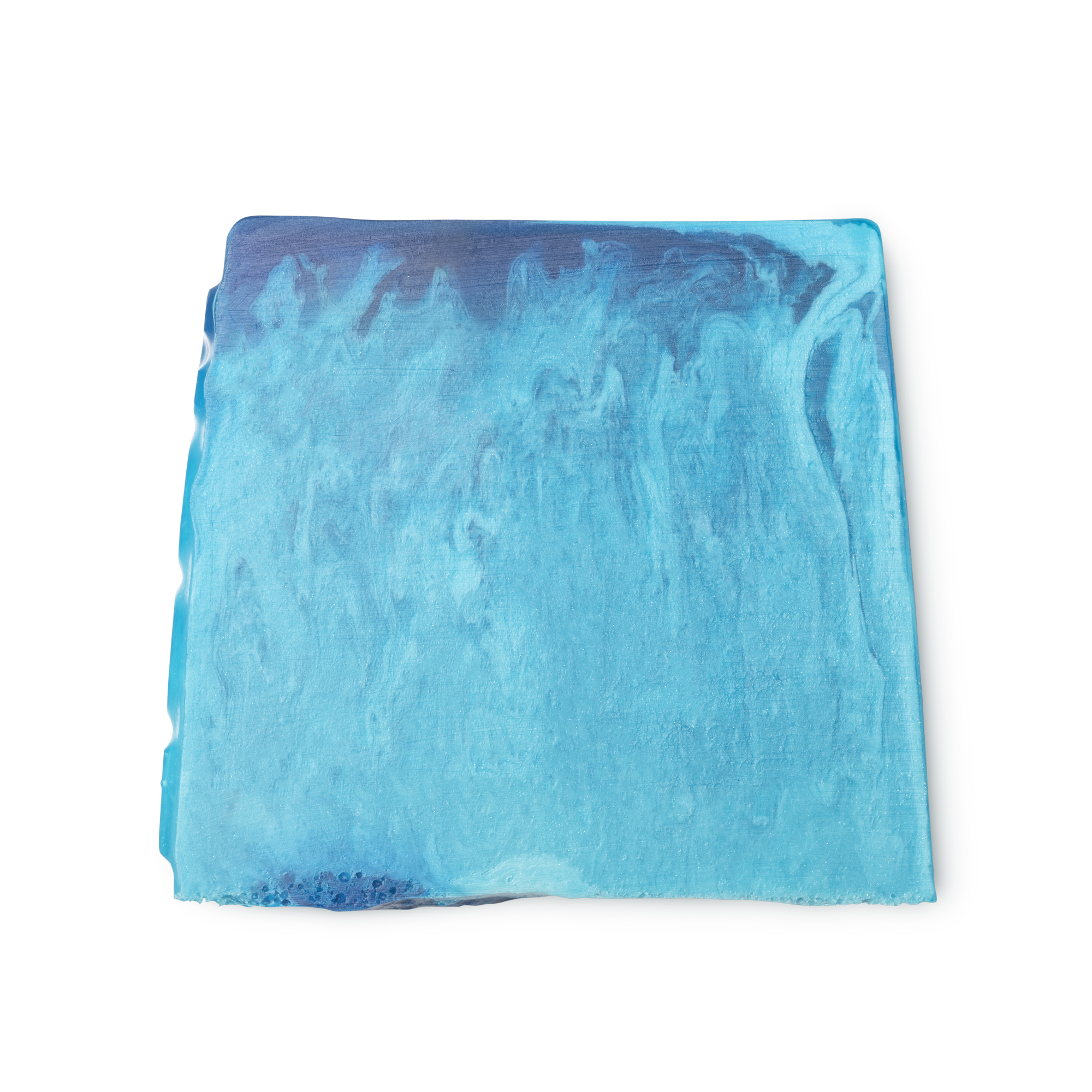Outback Mate. A bright blue, smooth, trapezium shaped soap, with bumps along its left side and a wavy design in the mix.