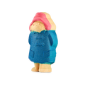Paddington. A detailed bath bomb shaped like Paddington Bear, wearing his iconic red hat and blue raincoat. The character is standing upright and features a slight glitter in the blue coat.