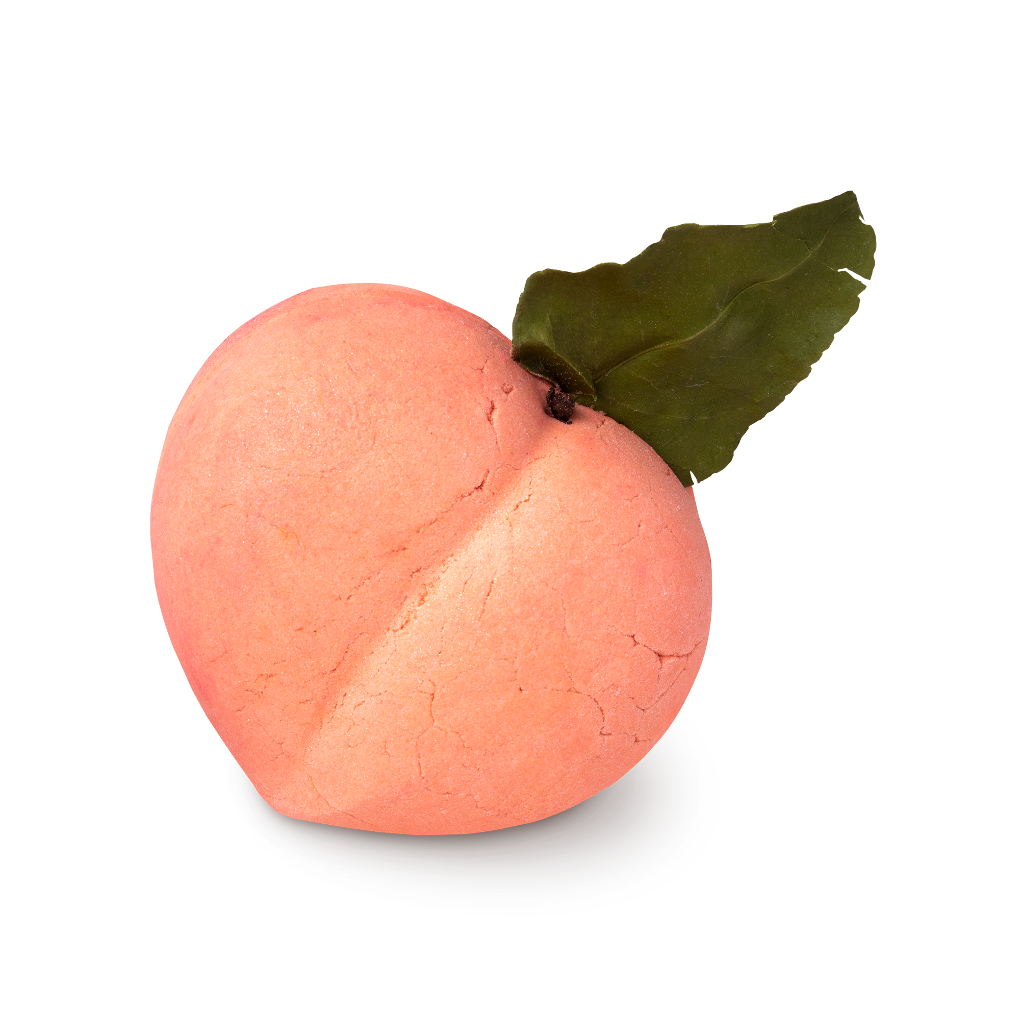 Peach Crumble Bubble Bar. Shaped like a peach in the natural orange and pink colour with a green leaf at the top.