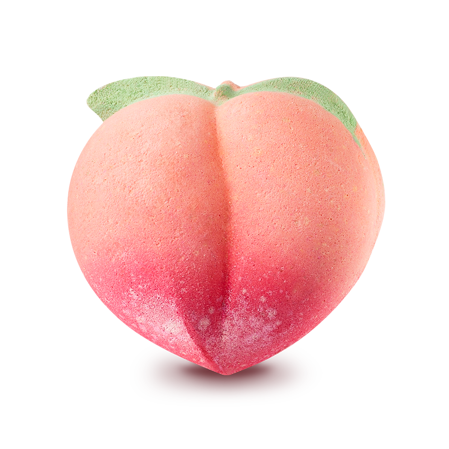Peachy. A peach-shaped bath bomb featuring a soft orange and pink gradient, darkening to a deep pink at the base. Two small green leaves are moulded at the top near the stem.