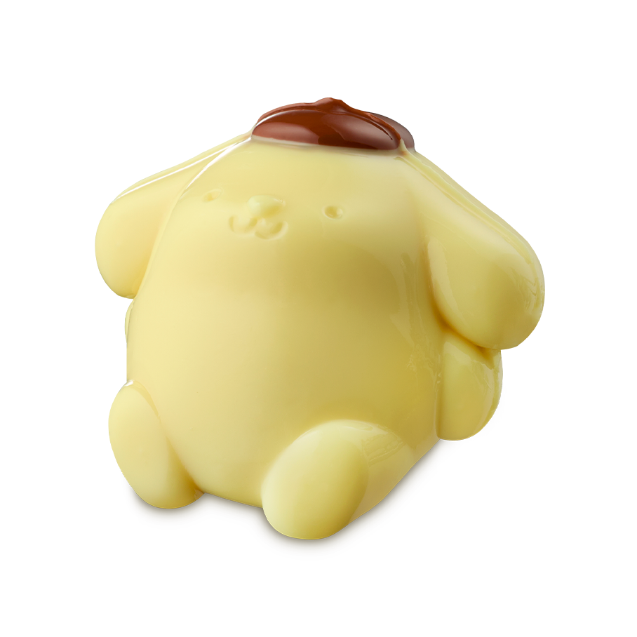 Pompompurin. A glossy, pale yellow shower jelly shaped like the character Pompompurin. The rounded, dog-like figure has a small brown beret on its head and is shown from a slight angle.
