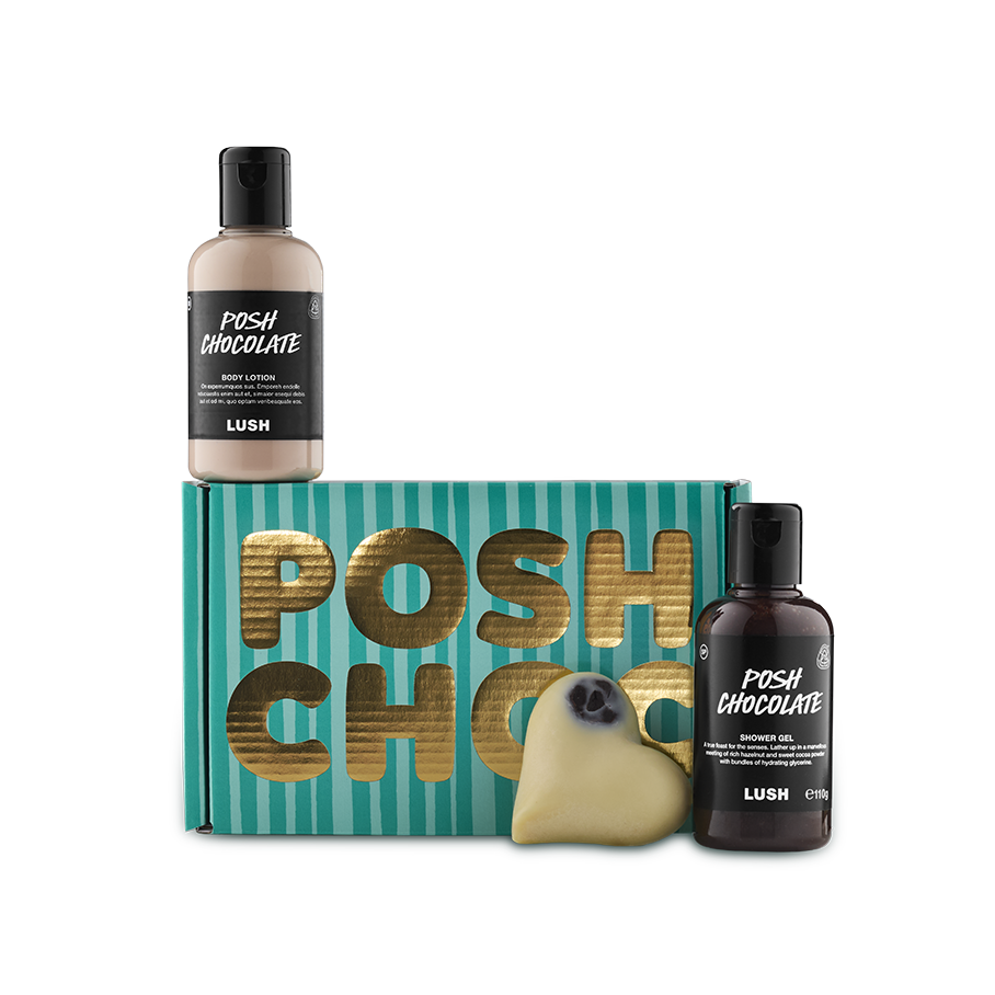 Posh Choc. A rectangular, cardboard gift box designed with light and dark teal stripes with the words "Posh Choc" in thick gold writing. A massage bar, Posh Chocolate body lotion and shower gel sit around the box.