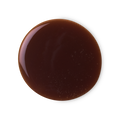 Posh Chocolate. A perfectly circular swatch of thick, glossy, caramel-chocolate-coloured shower gel.