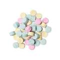 A pile of small, circular, multicoloured Refresher toothpaste tabs shot from above.