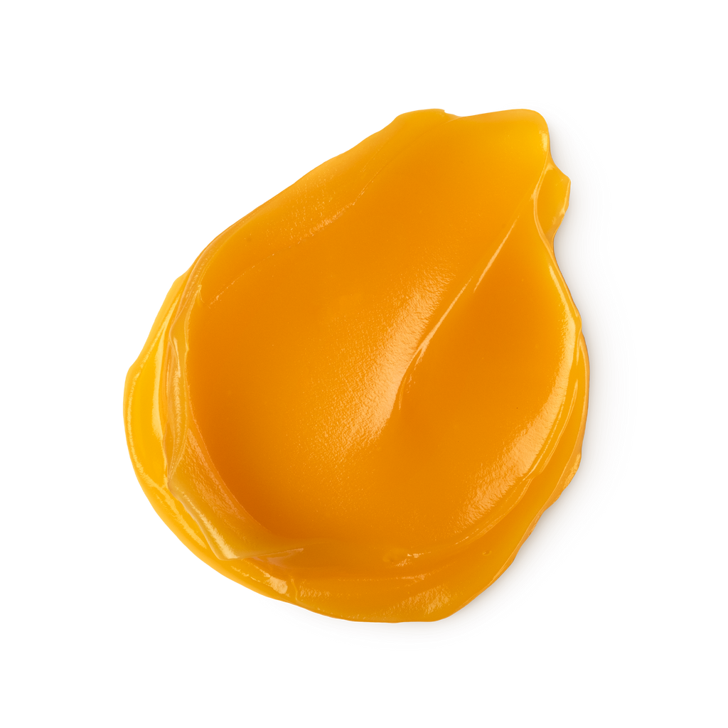 A swatch of thick, vibrant orange coloured Repeat foot balm.