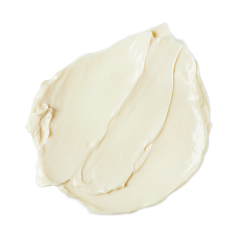 Retread. A smooth, thick dollop of cream-coloured hair conditioner. The product has a rich, glossy consistency with gentle swoops and ridges from being swirled, showing a soft, moisturising texture.