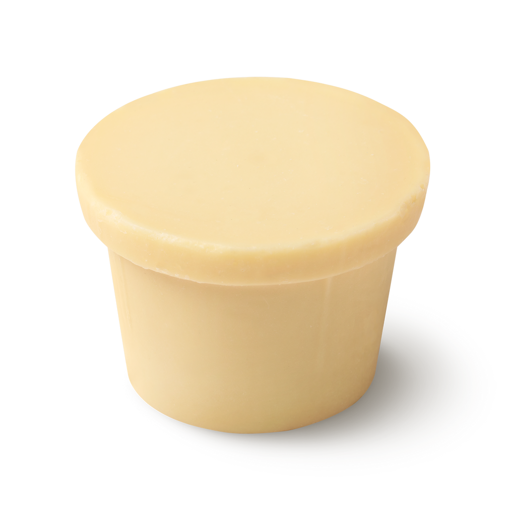 A cream coloured, naked body conditioner, shaped like an upside down top hat, with a 'brim' on top of a narrow cylinder.