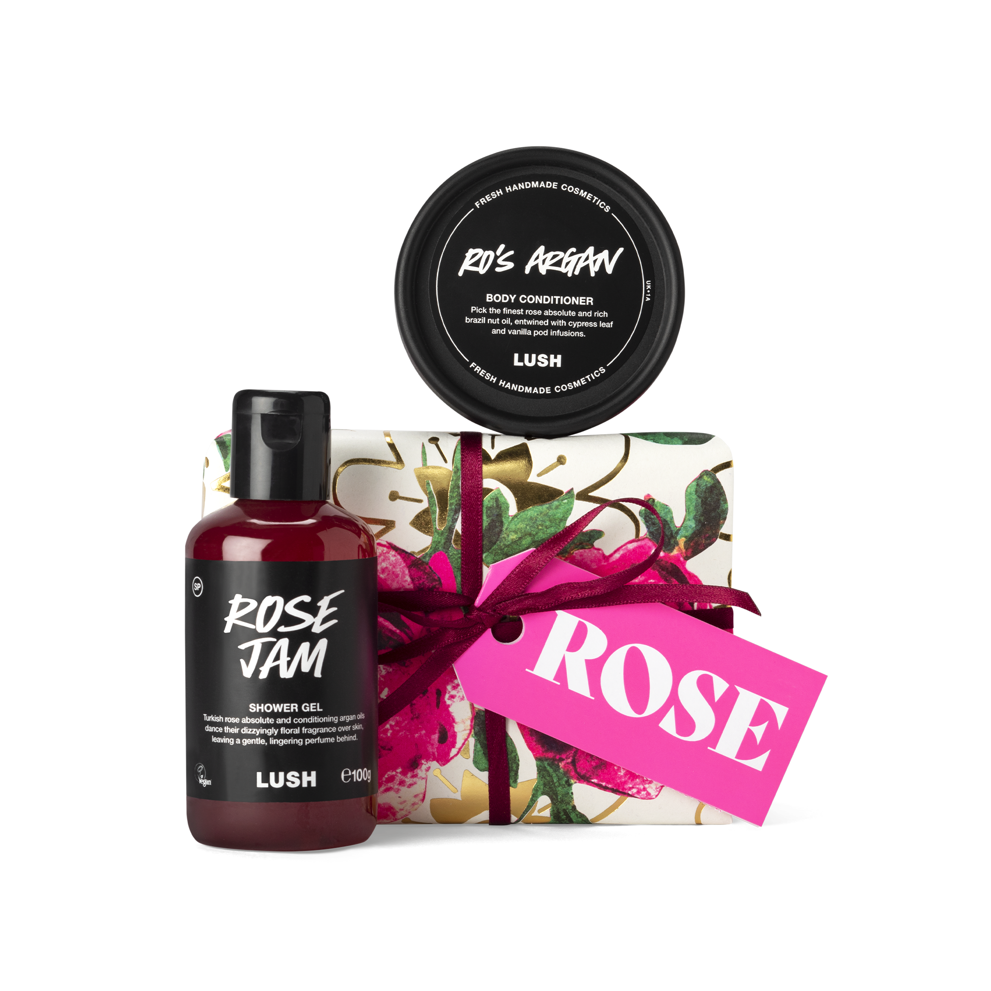 Rose. A small, rectangular box, wrapped in white, rose printed Khadi paper, tied with a burgundy ribbon and a pink gift tag.