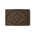 Rouge Henna. A brown rectangular block of solid henna hair colour, with a floral design and the letter R pressed on the top.