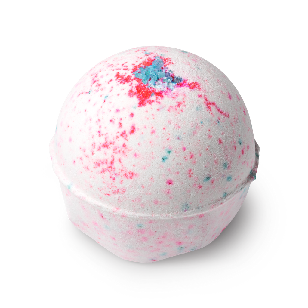 Sakura. A round bath bomb, white in colour with flecks of pink and blue, topped with a sprinkling of blue coloured coarse salt.