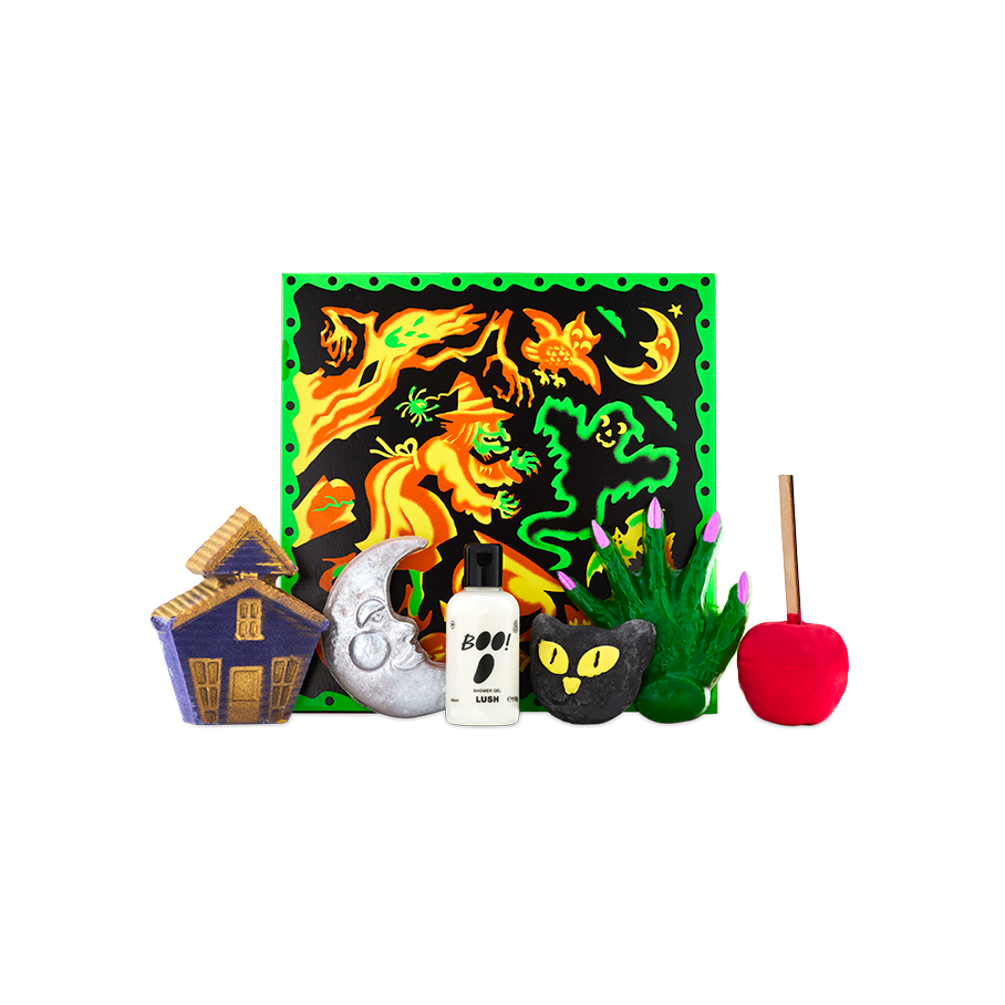 Season of the Witch gift. A colourful witch-themed gift box stands behind an array of six Halloween-themed bathing products, including bath bombs, a shower gel, a bubble bar and a shower gummy.