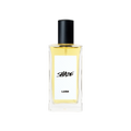 A glass perfume bottle filled with pale yellow liquid. A white label reads 'Shade'.