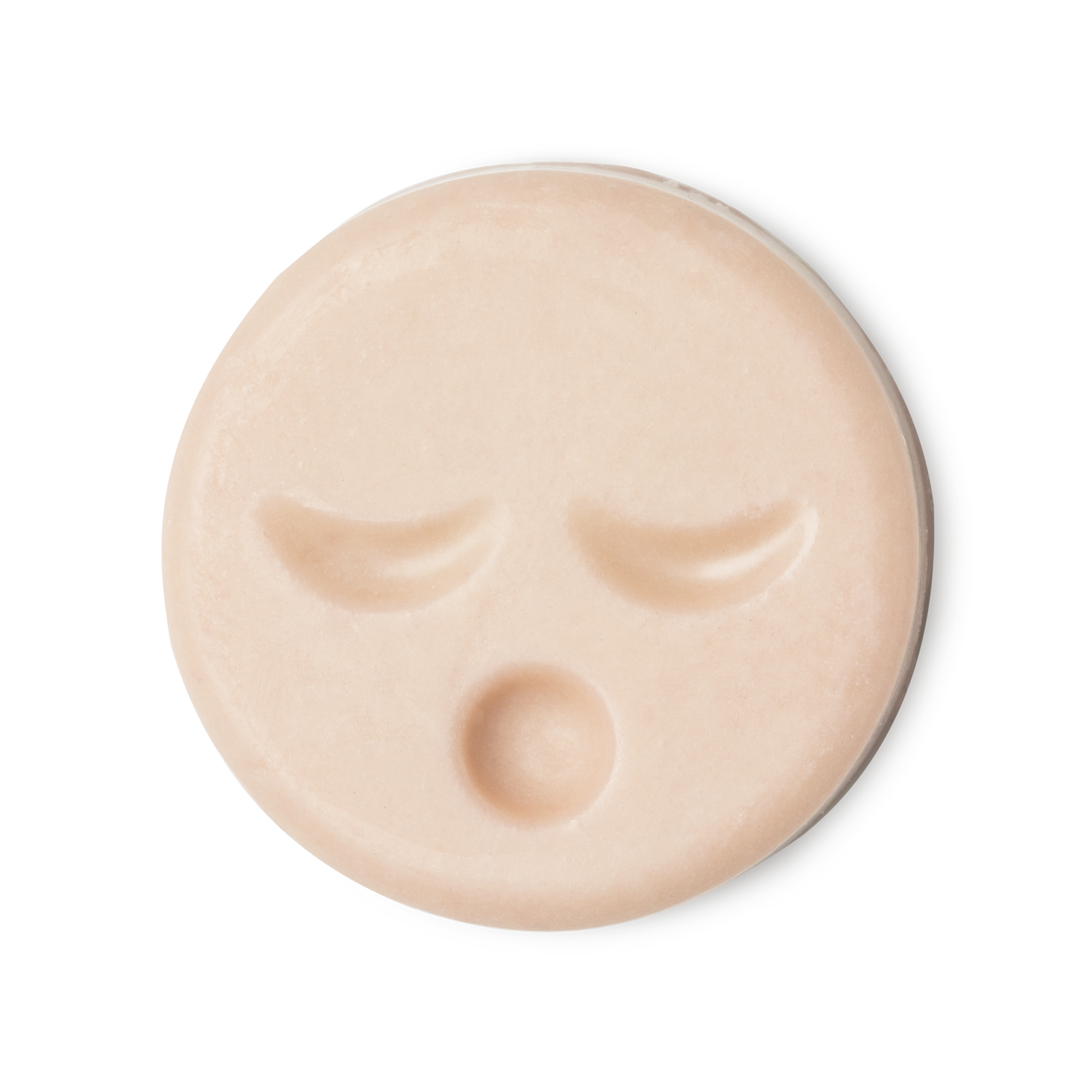Sleepy Face. A circular, pale peachy pink naked cleansing balm, engraved with little yawning face.