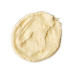 St Clements. A rounded, smeared swatch of thick, pale yellow hair treatment mask with a smooth, slightly textured finish. The swatch shows visible streaks from being spread.