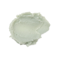 A swatch of very thick, balmy, pale green coloured Superbalm scalp treatment.