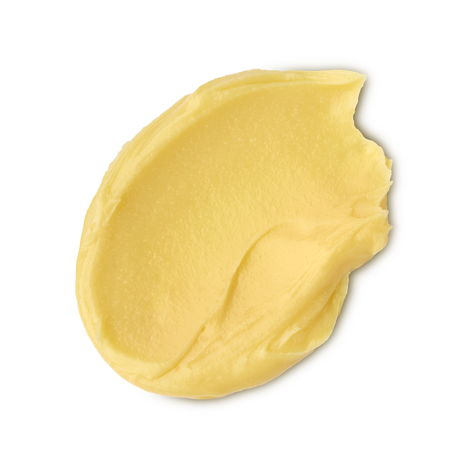 Turmeric And Argan. A neatly smudged swatch of creamy, soft, buttery-yellow facial cleanser.