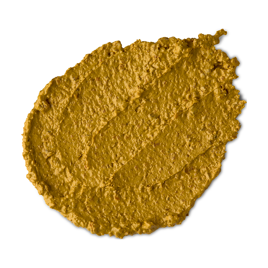 Turmeric. A smudged swatch of textured, creamy, golden-yellow Turmeric face mask.