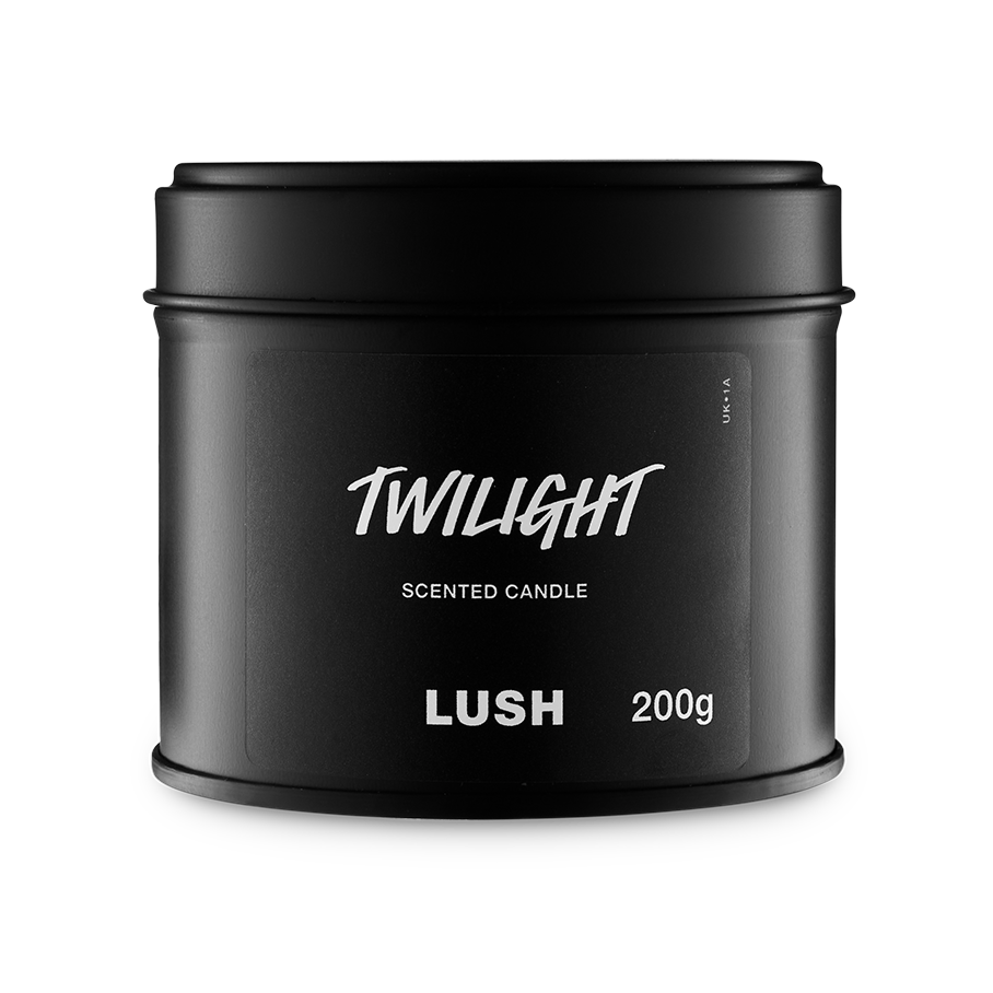 Twilight. A round, black, candle tin with a removable lid. The black label on the front reads "Twilight Scented Candle" in white text.
