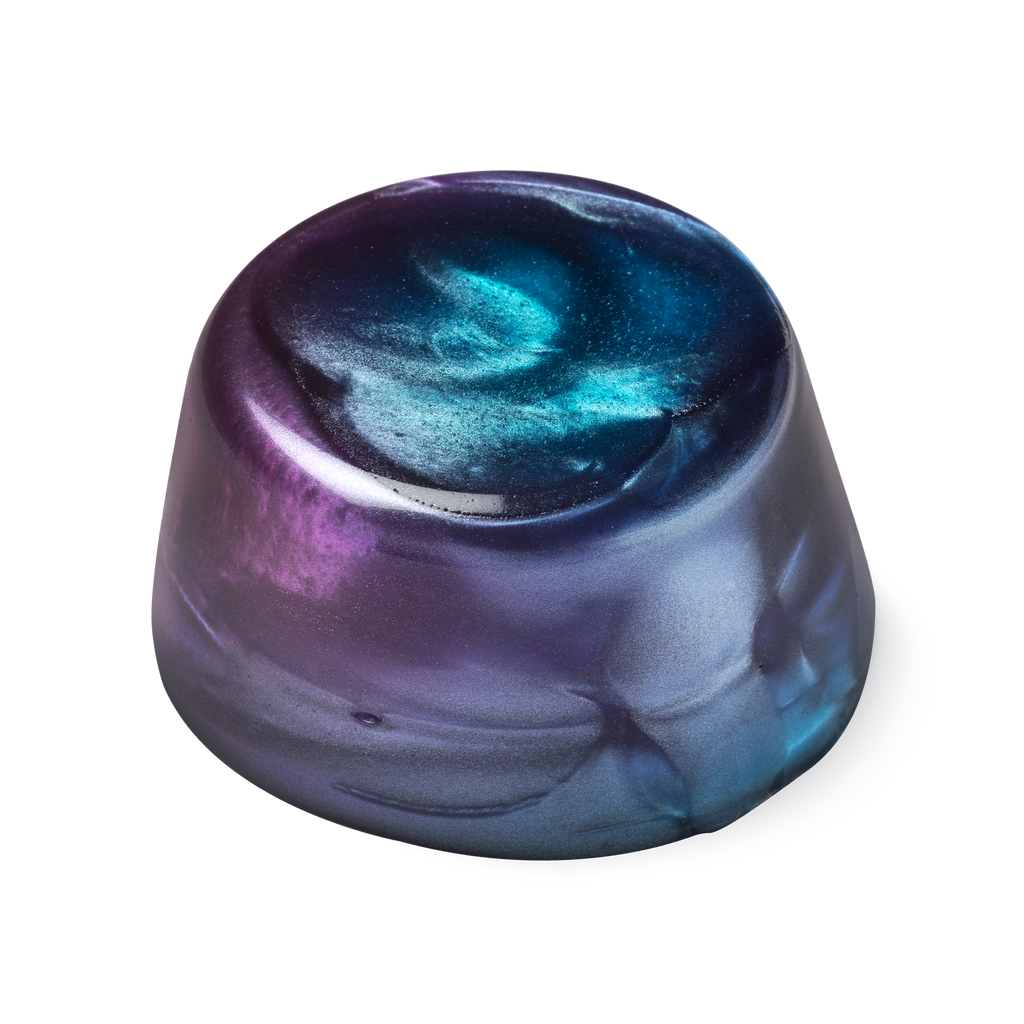 Twilight. A metallic blue, purple and pink coloured, glossy looking, cylindrical shaped shower jelly.