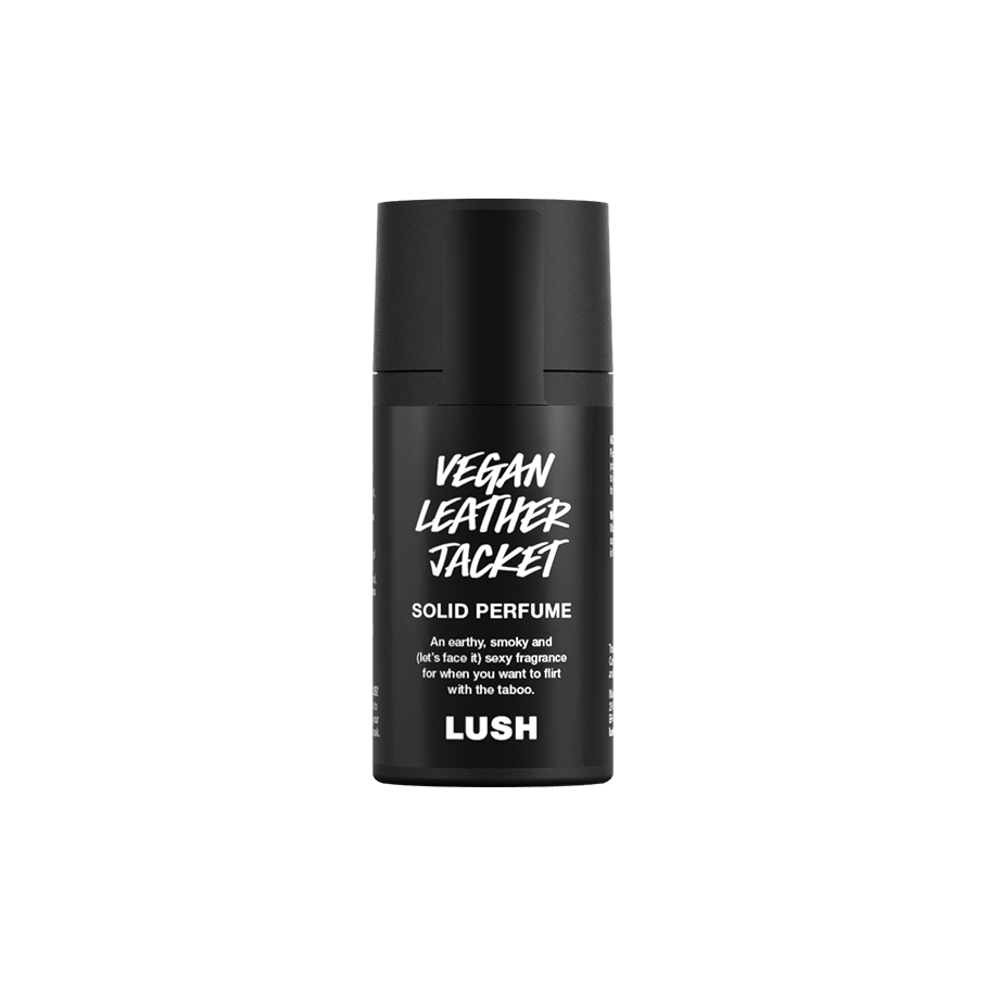Vegan Leather Jacket. A short, cylindrical black push-up tube of the Vegan Leather Jacket solid perfume with a black label on the front covering the cap, with the product name and scent printed on it.
