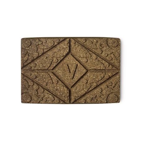 Vénitien Henna. A brown rectangular block of solid henna hair colour, with a floral design and the letter V pressed on the top.