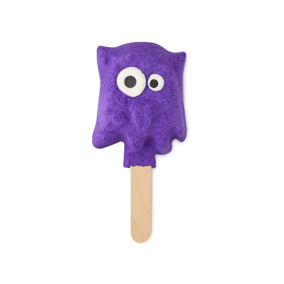 Worry Monster. A fun, bright purple bubble bar in the shape of a non-uniformed blob with a pair of mismatched bright eyes. The bubble bar is attached to a wooden stick, looking almost ice-lolly-like.
