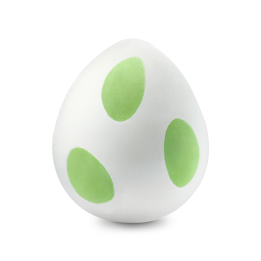 The Yoshi Egg a white egg-shaped bath bomb with three lime-green oval spots.